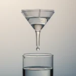 Glass funnel filtering tinted liquid; a clear droplet falls into a label-free beaker, symbolizing signal distilled from noise.
