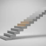 Minimalist staircase with one illuminated step against a soft neutral background.