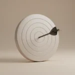 Single arrow centered on a bullseye target, symbolizing shared project goals and a clear definition of success.