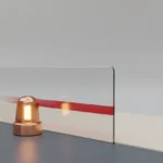Amber warning beacon beside a translucent barrier, symbolizing the point when a team risk becomes a blocker.