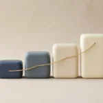 A smooth gold line rises across four connected pricing blocks, symbolizing a gradual, trust-preserving rate increase.
